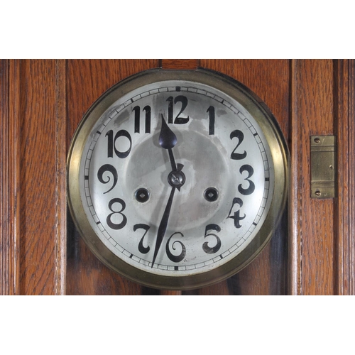 89 - Early 20thC oak cased wall clock.