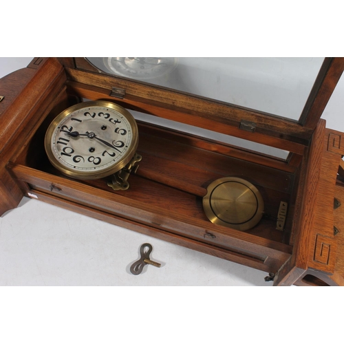 89 - Early 20thC oak cased wall clock.