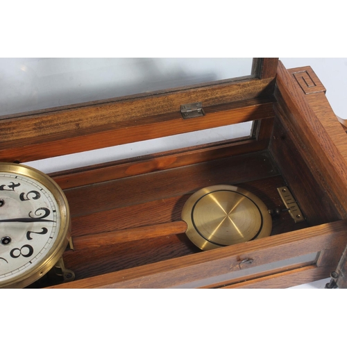 89 - Early 20thC oak cased wall clock.