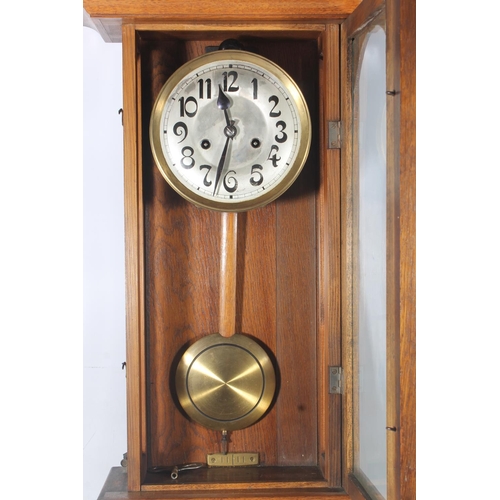 89 - Early 20thC oak cased wall clock.