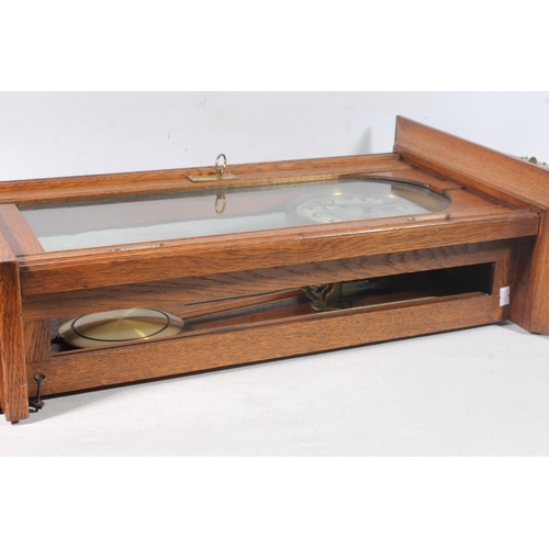 89 - Early 20thC oak cased wall clock.