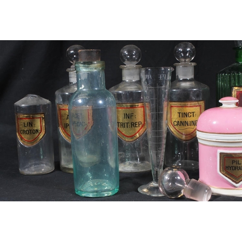 92 - Early 20thC glass apothecary bottles and a Victorian pottery drug jar.