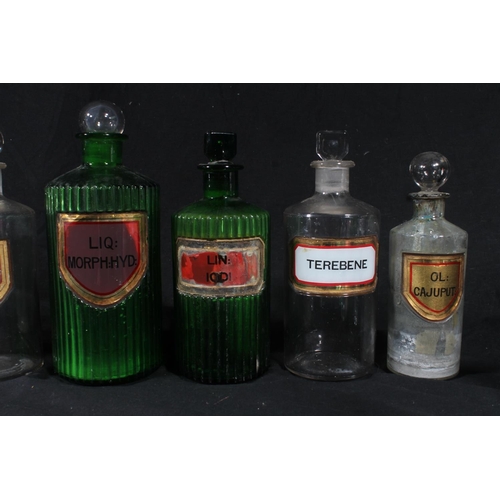 92 - Early 20thC glass apothecary bottles and a Victorian pottery drug jar.