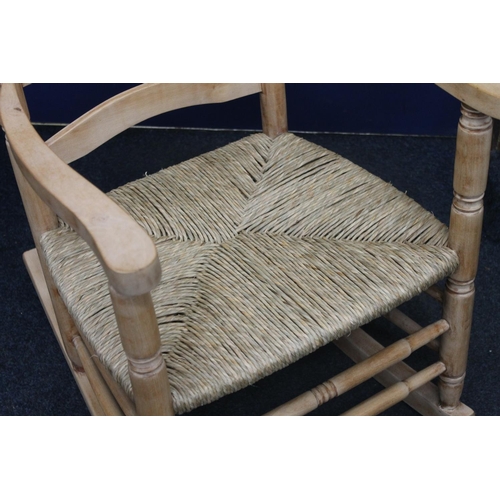 86 - 1970s Pine rush seated rocking chair.