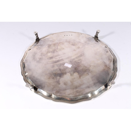 1 - Geo. V silver salver, the plain tray with pie crust border raised on four hoof feet, R&W Sorley ... 