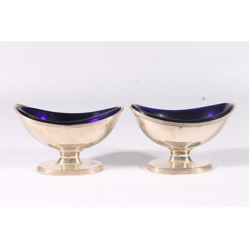 11 - Four Geo. IV silver navette shape salts, with reeded border and foot with fitted blue glass liners, ... 