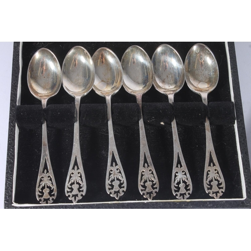 13 - Cased set of six hallmarked silver handled pistol grip butter knives, cased set of silver teaspoons ... 