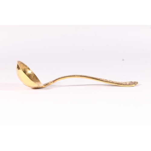 19 - American early 20th century silver gilt ladle, the shaped terminal well cast with classical scene of... 