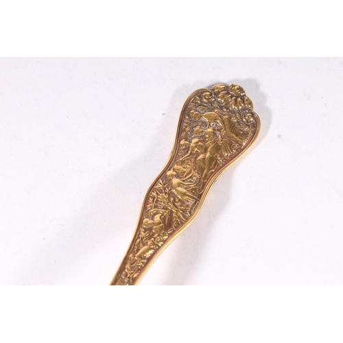 19 - American early 20th century silver gilt ladle, the shaped terminal well cast with classical scene of... 