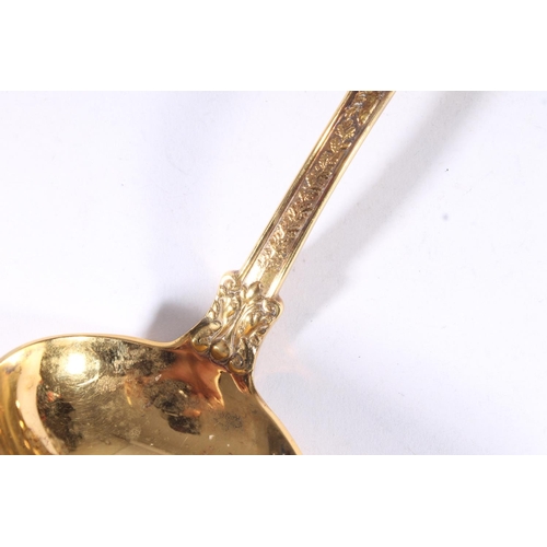 19 - American early 20th century silver gilt ladle, the shaped terminal well cast with classical scene of... 