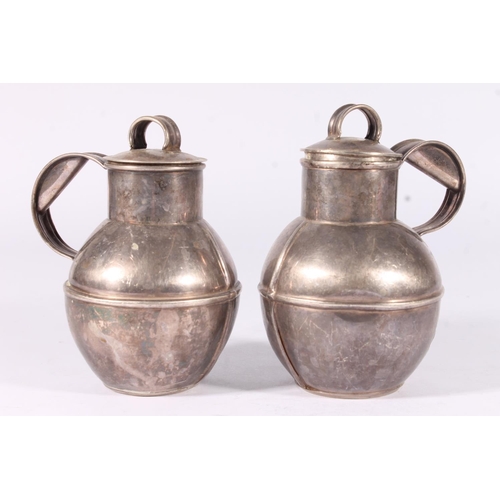 37 - A pair of ER.II Guernsey silver lidded milk jugs together with a small lidded cream jug, hallmarked ... 