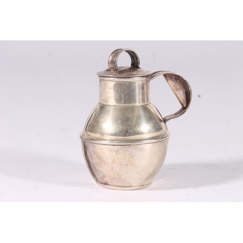 37 - A pair of ER.II Guernsey silver lidded milk jugs together with a small lidded cream jug, hallmarked ... 