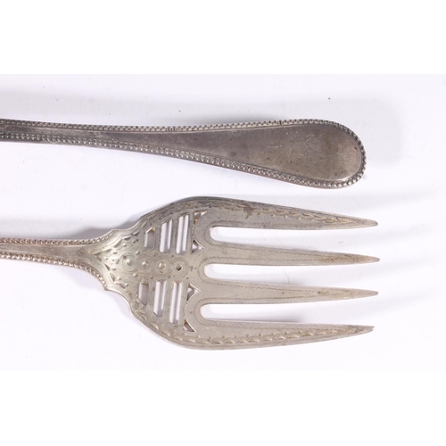 46 - Victorian silver fish servers, the blades with pierced bars within an engraved and beaded border, Ma... 