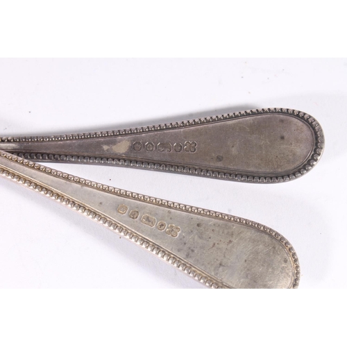 46 - Victorian silver fish servers, the blades with pierced bars within an engraved and beaded border, Ma... 