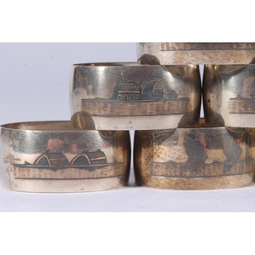 47 - Set of six Iraqi white metal Niello napkin rings decorated with river and landscape scenes.