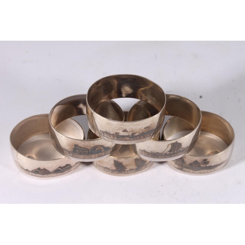 47 - Set of six Iraqi white metal Niello napkin rings decorated with river and landscape scenes.