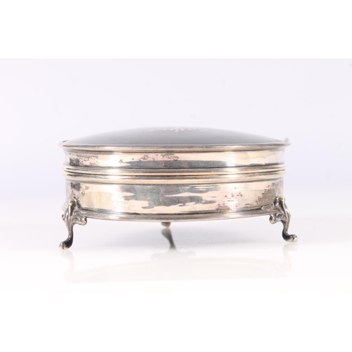 50 - Geo.V silver and tortoiseshell dressing table box, of round form with inlaid cover and on three Quee... 