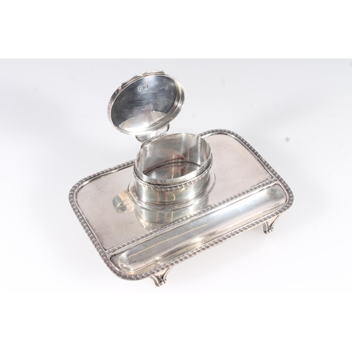 51 - Geo.V silver inkstand, the rectangular stand with canted corners and gadrooned rims, recessed pen be... 