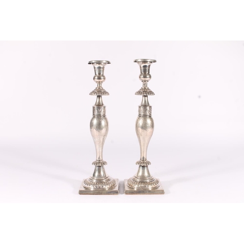 61 - Pair of weighted German Prussian silver candlesticks, early to mid 19th century, the round sconces a... 