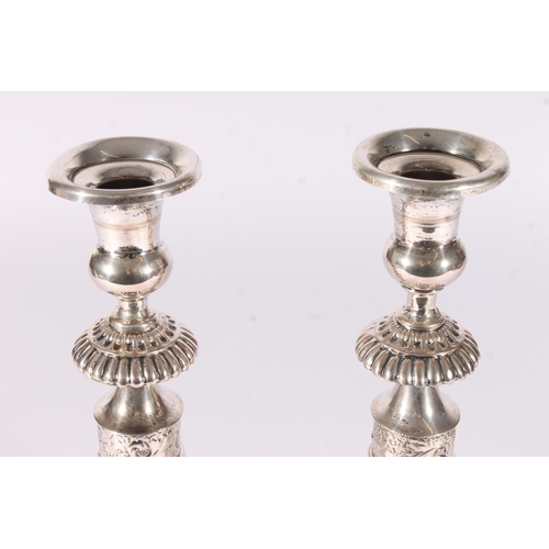 61 - Pair of weighted German Prussian silver candlesticks, early to mid 19th century, the round sconces a... 