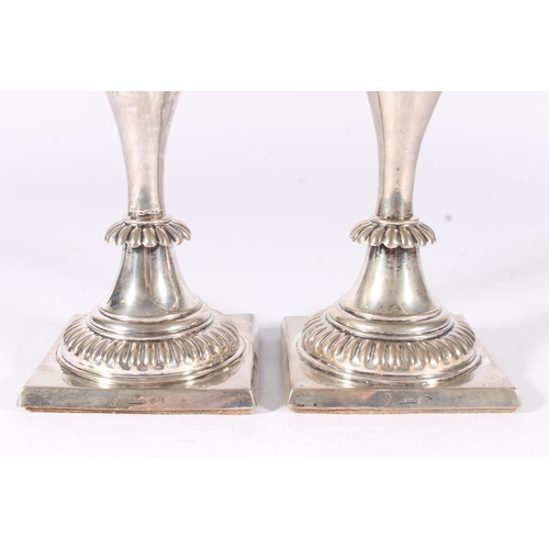 61 - Pair of weighted German Prussian silver candlesticks, early to mid 19th century, the round sconces a... 