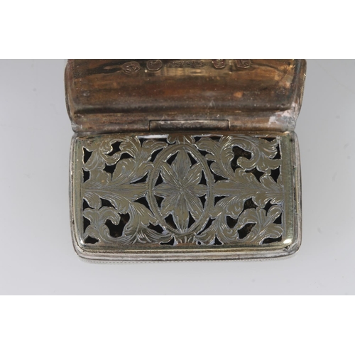 64 - Geo.III silver vinaigrette, of rectangular curved shape with engraved leaf decoration, opening to re... 