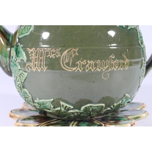 311 - Victorian Dunmore pottery Majolica teapot, of mottled green and brown glaze around an ivy framed car... 