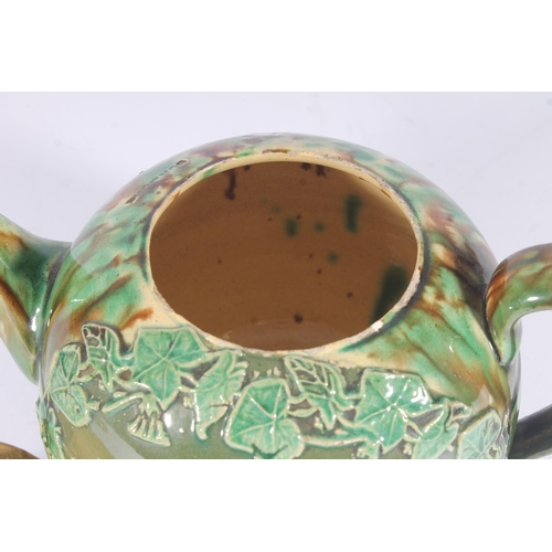 311 - Victorian Dunmore pottery Majolica teapot, of mottled green and brown glaze around an ivy framed car... 