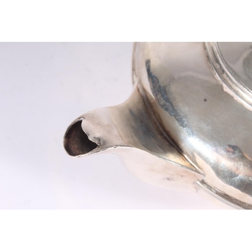 8 - Geo. IV silver teapot, the cast foliate finial above hinged cover, ovoid ribbed body and ear shape h... 