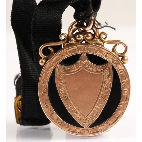 50 - 9ct gold masonic medallion with black enamel inlay 8.7 grms gross....