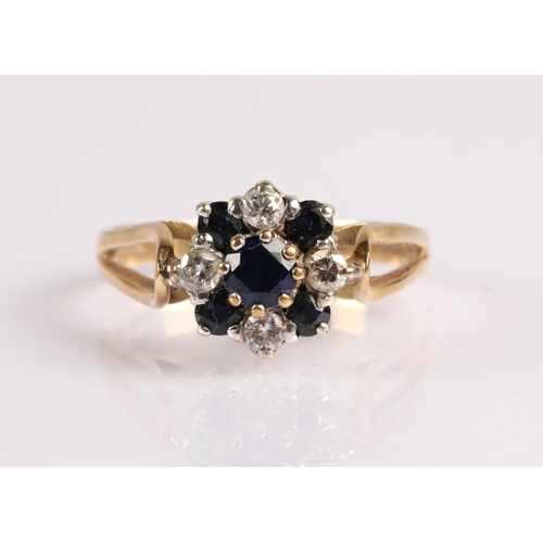 58 - 9ct gold cluster ring set with central blue stone and diamonds alternating with darker blue gems. Ri... 