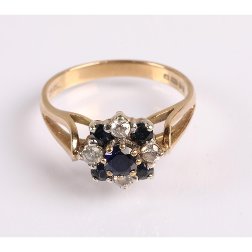 58 - 9ct gold cluster ring set with central blue stone and diamonds alternating with darker blue gems. Ri... 