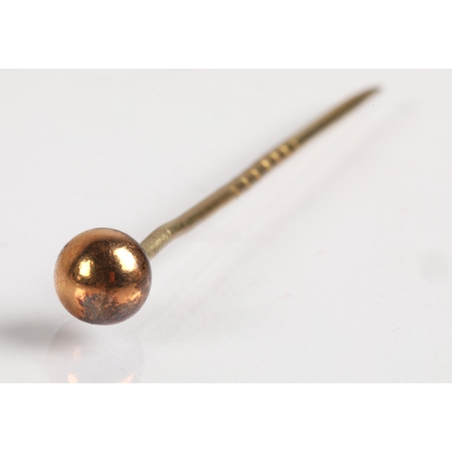 62 - Yellow metal stick pin with cylinderical knop.