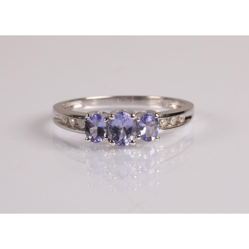 67 - 9ct white gold dress ring set with diamonds and tanzanite, ring size P, 2.1g.