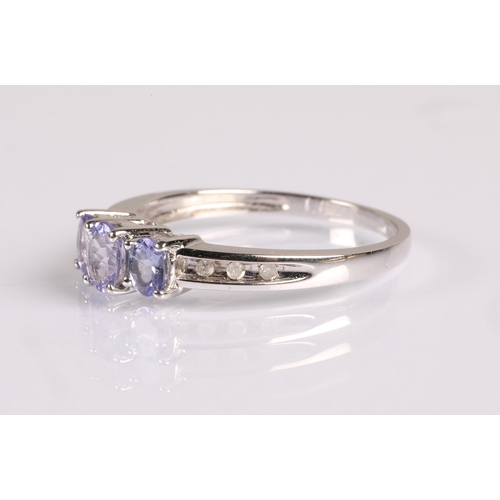 67 - 9ct white gold dress ring set with diamonds and tanzanite, ring size P, 2.1g.