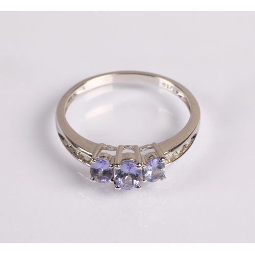 67 - 9ct white gold dress ring set with diamonds and tanzanite, ring size P, 2.1g.