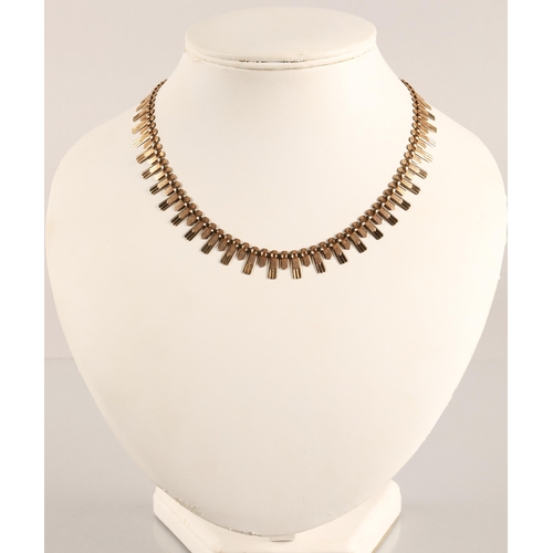 69 - 9ct gold fringe necklace in the 1970's Brutaliist style, 16g.