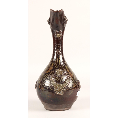 28 - Stoneware brown glazed relief decorated jug, 40cm...