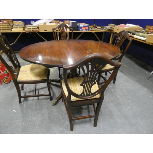 299 - Small oval extending pedestal dining table and four shield back chairs. (5)