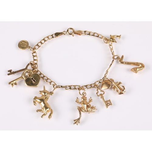 90 - 9ct gold charm braclet with charms including horse, frog, key, St Christopher, saxophone etc. 8.4g g... 