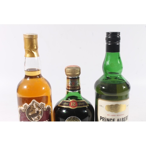 1437 - Three old blended bottles of Scotch whisky to include PRINCE ALBERT de-luxe reserve by Crown Distill... 