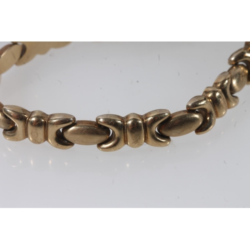 109 - 9ct gold fancy link bracelet with Albert bar terminals, 12.1g.