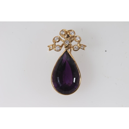 112 - 18ct gold mounted pendant set with faceted tear drop shaped amethyst surmounted by a bow set with sm... 