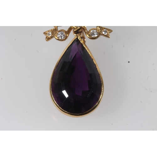 112 - 18ct gold mounted pendant set with faceted tear drop shaped amethyst surmounted by a bow set with sm... 