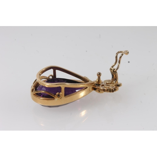 112 - 18ct gold mounted pendant set with faceted tear drop shaped amethyst surmounted by a bow set with sm... 