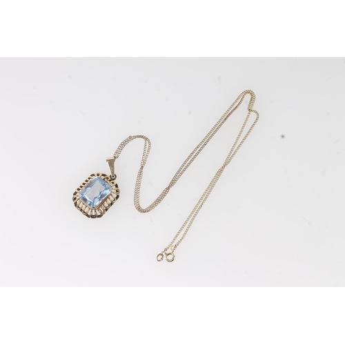 119 - 14ct gold mounted Brutalist style pendant set with faceted aquamarine coloured blue stone, the hoop ... 