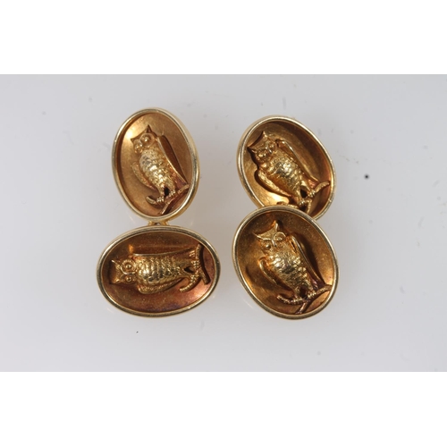 127 - Pair of unhallmarked yellow metal oval cufflinks with relief owl decoration, makers mark possibly 'R... 