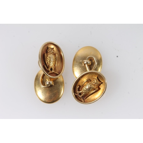 127 - Pair of unhallmarked yellow metal oval cufflinks with relief owl decoration, makers mark possibly 'R... 