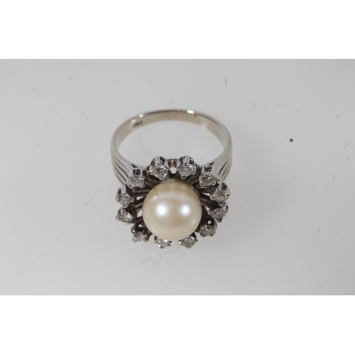 131 - 14ct white gold and solitaire pearl ring, the round pearl within a halo of round cut diamonds on a s... 