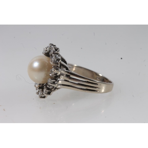 131 - 14ct white gold and solitaire pearl ring, the round pearl within a halo of round cut diamonds on a s... 